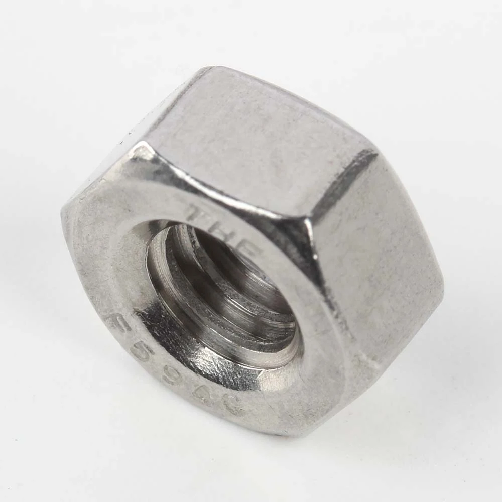 Angled view of a stainless steel regular hex nut with THE F594C marking