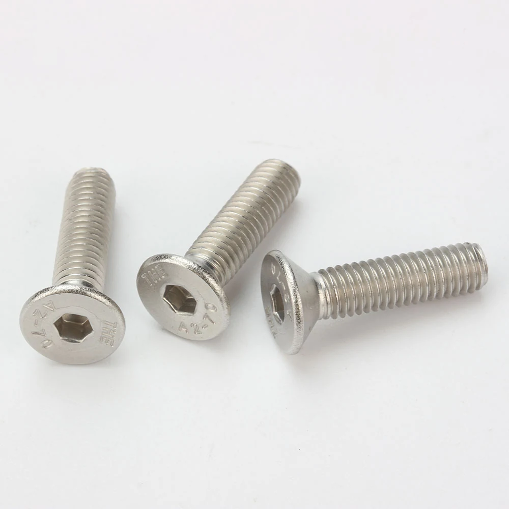 THE DIN 7991 stainless steel hex socket countersunk screws on a white background