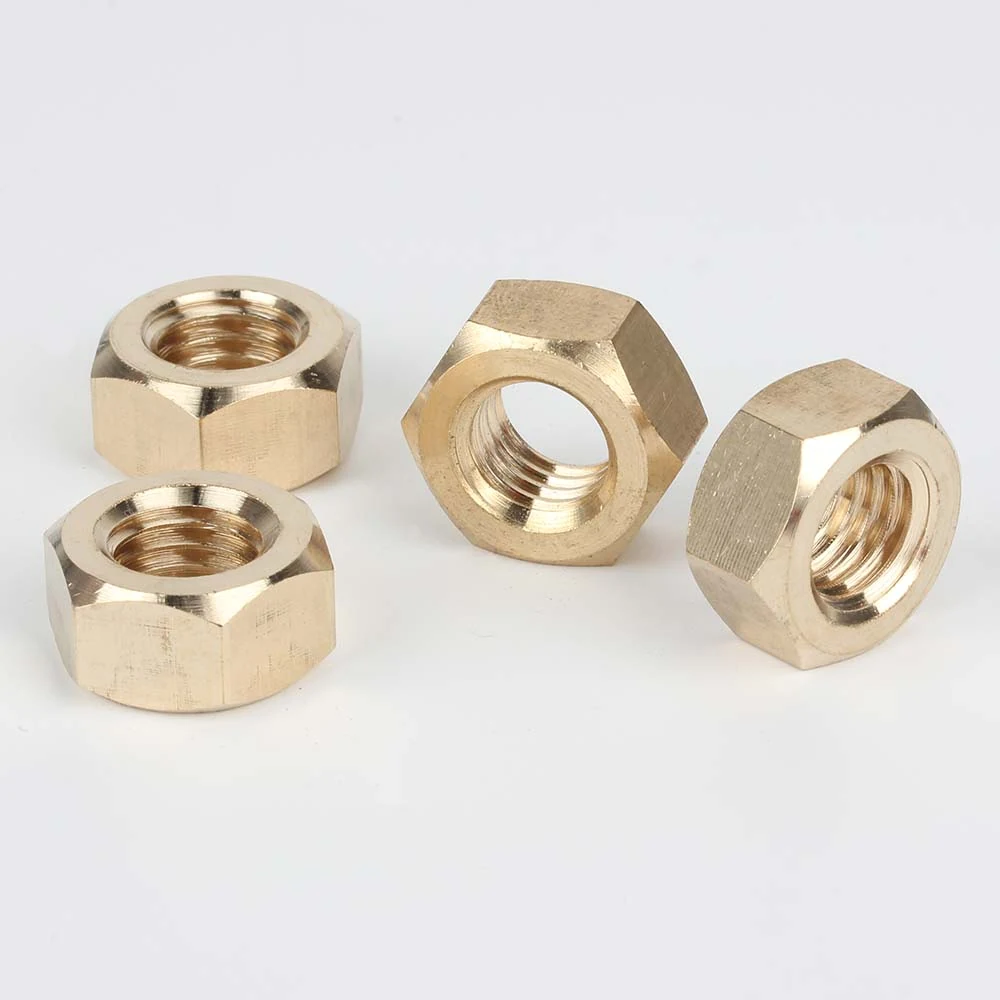 DIN 934 brass hexagon nuts shown from multiple angles with visible threads and side profiles