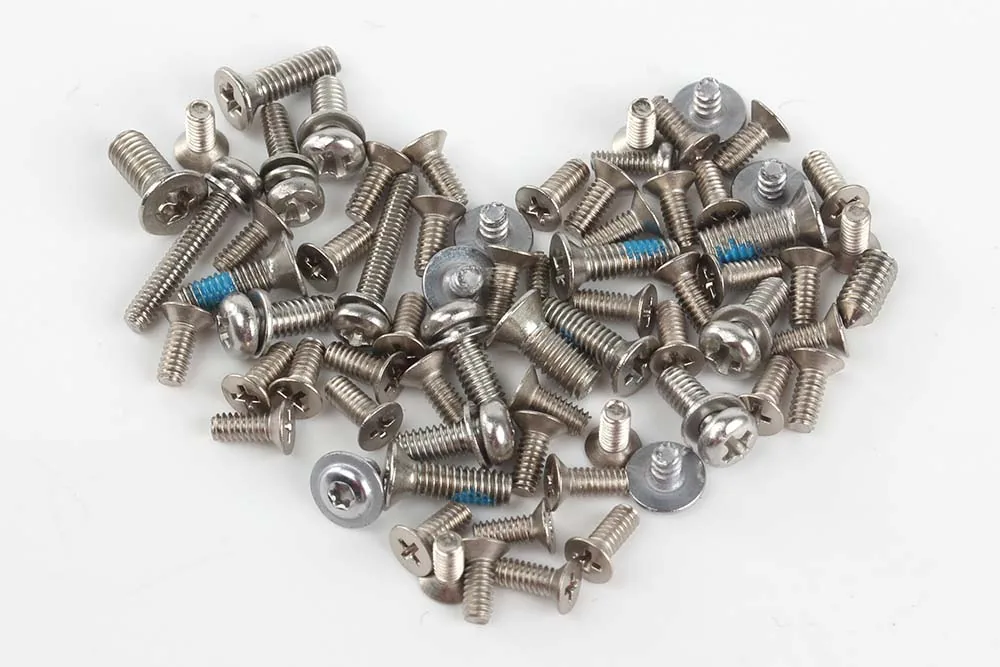 Assorted screws and fasteners arranged in a heart shape for the Tongming standards and materials guide